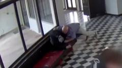 Moment gunman tackled by school principal