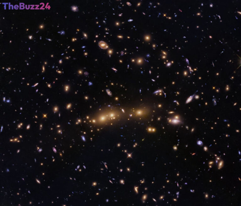 Hubble Captures Cosmic Collision: Merging Galaxy Clusters Revealed