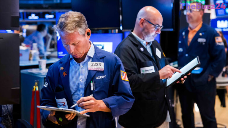 Wall Street Tugs Between Blockbuster Earnings and Chip Sector Slump as Global M&A Surges