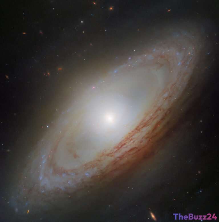 Hubble Unveils Cosmic Anomaly: A Galaxy’s Perpendicular Heart