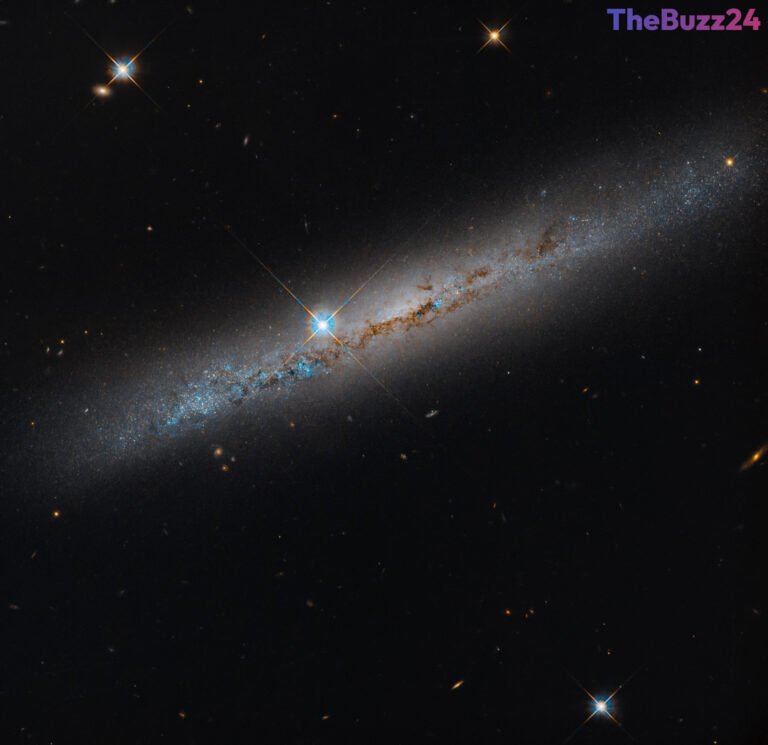 Hubble Captures Stunning Detail of Edge-On Spiral Galaxy NGC 1827